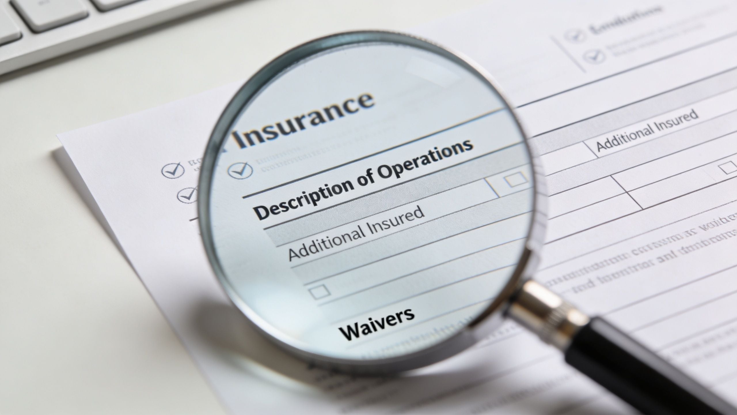 A magnifying glass focused on the insurance document section labeled Description of Operations for verification purposes.